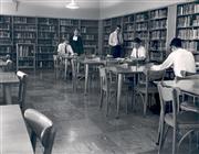 Brother Harold Frank, FSC, and students in the School's first library which was located on the main floor near the lobby. Circa 1967.