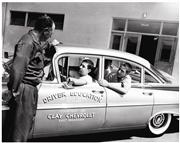 Duffy Lewis and three of his driver's education students. Circa 1958.