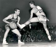 John Keese '66 leads the Lancer basketball team to victory.